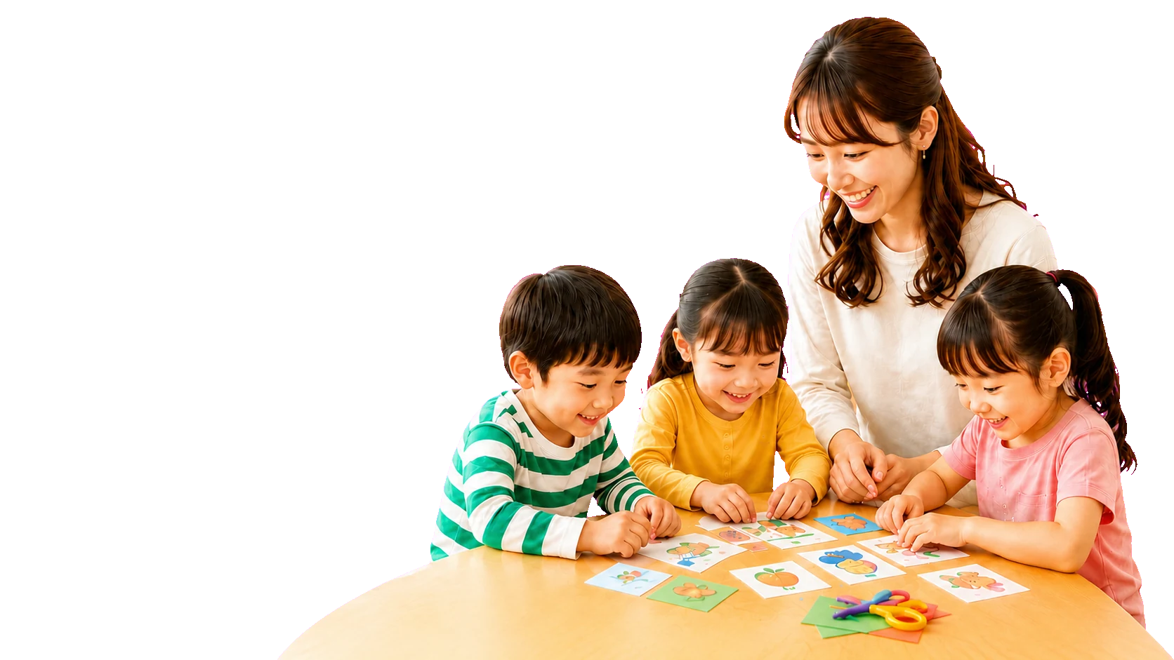 先生と3人の子どもたちが英語カードで楽しく学ぶ様子